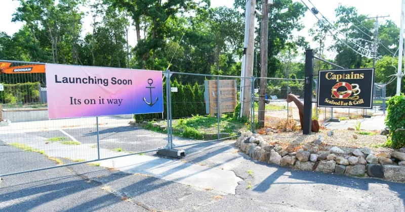 'Launching Soon' Banner Appears At Former Captain's Bar & Grille Site