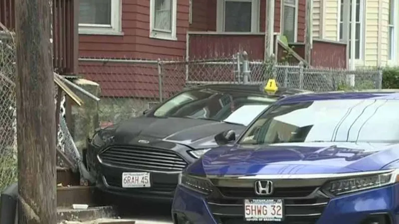 Police: Driver crashes into vehicles, through fence while fleeing traffic stop in Mattapan