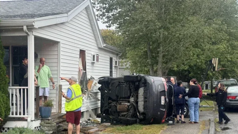 SUV rolls over and crashes into side of Beverly home, police say