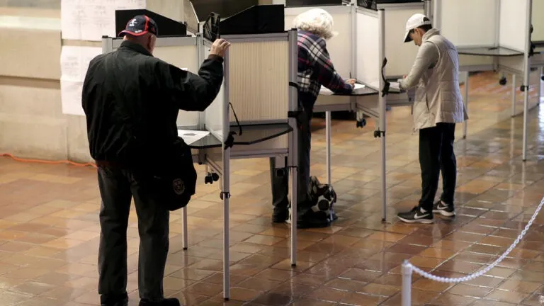 Question 4 could allow Mass. voters to register on Election Day. Here's what to know.