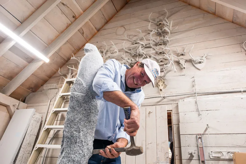 Chiseling a life with hammer and stone