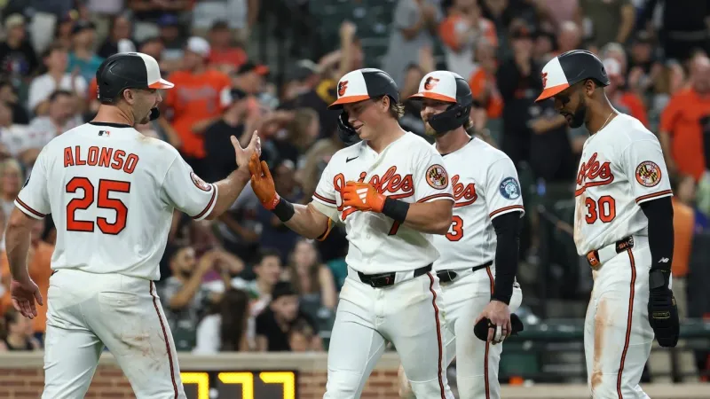 Holliday hits grand slam and Young pitches Orioles past Mariners 7-2 to stop 4-game slide