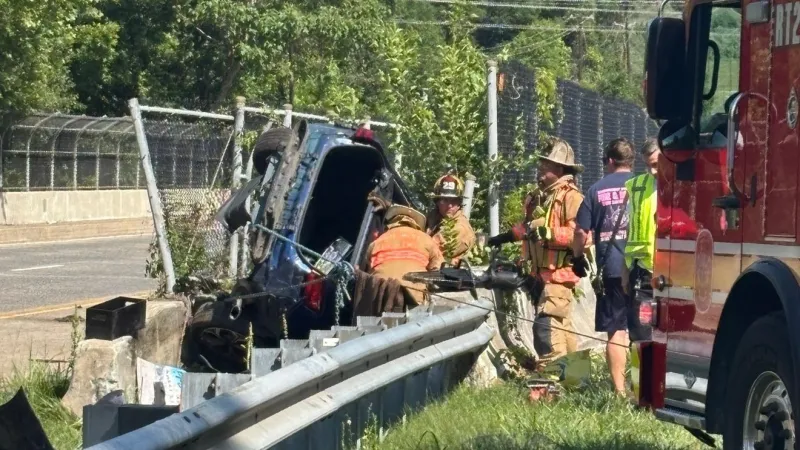 Car left hanging off edge of highway bridge after crash in Maryland