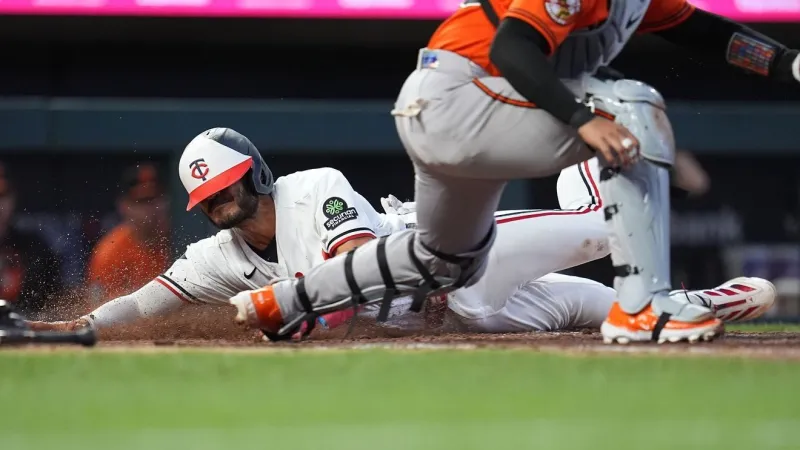 Martin goes 4 for 5, including a home run in the Twins' 9-5 win over the Orioles