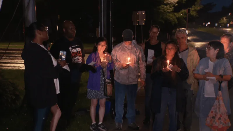 Community, family gather for vigil to honor father of 5 killed in crash by stolen car