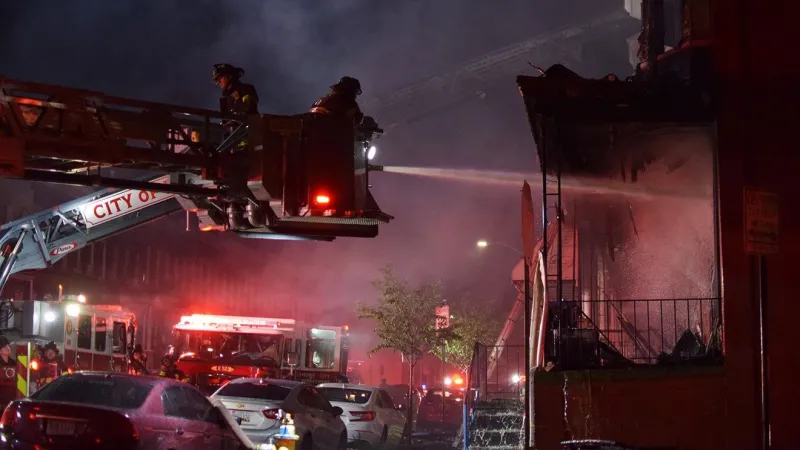 Crews battle west Baltimore rowhome fire Wednesday night
