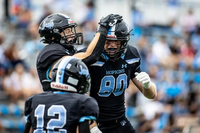 Hopkins Honors Margraff, Tops Ithaca, 30-21, in Season Opener