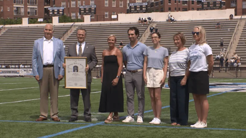 Hopkins Honors Margraff, Tops Ithaca, 30-21, in Season Opener