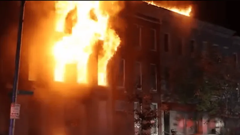 Firefighters battle heavy fire at vacant home in southwest Baltimore