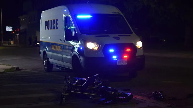 Dirt bike collides with car in east Baltimore, leaving man critically injured