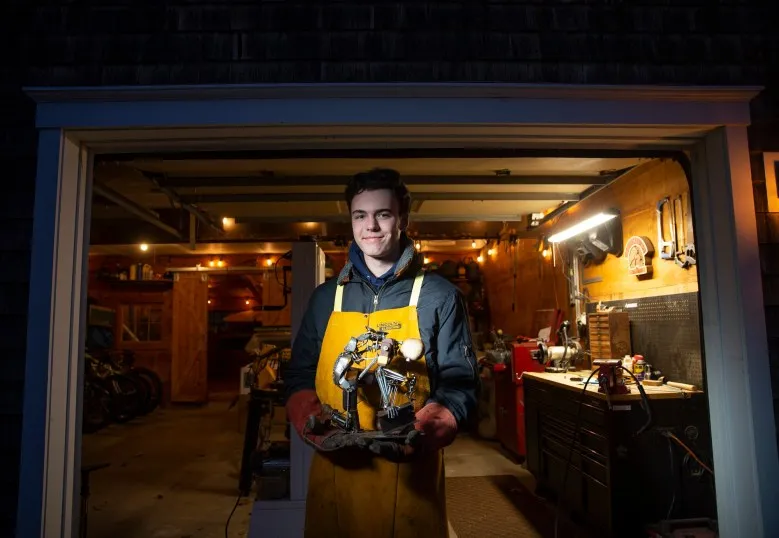Freeport teenager welding metal sculptures with a message