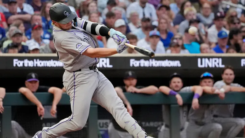 Goodman hits 3 homers, Rockies beat Twins 8-5