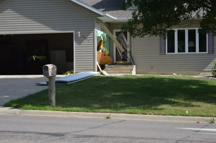 Pickup hits house, garage in Marshall