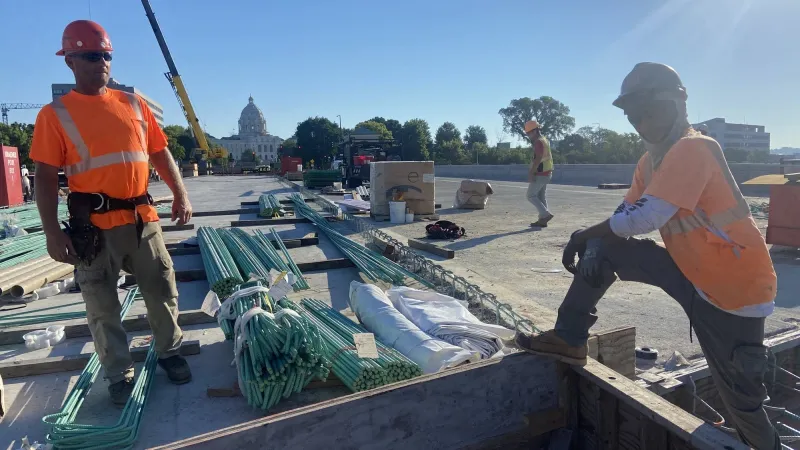 In extreme heat, constructions workers still report for duty. How they're staying safe