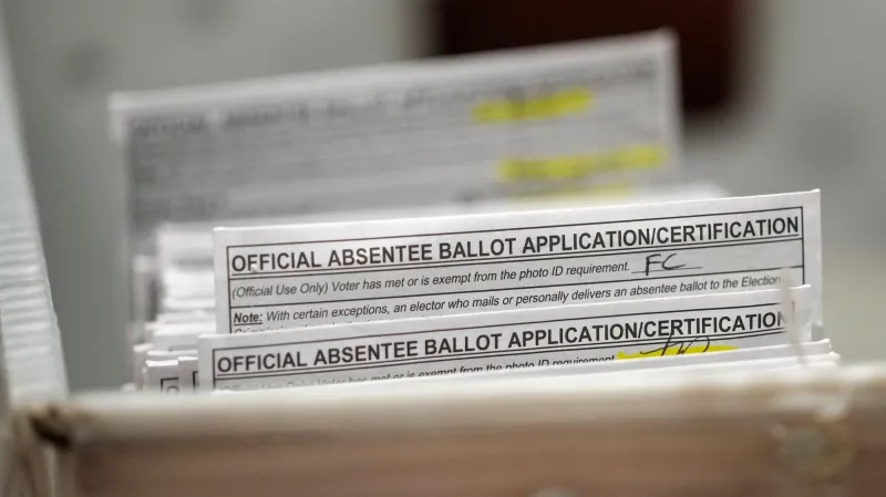 Wisconsin voters begin casting ballots at the polls in chaotic Democratic governor's race
