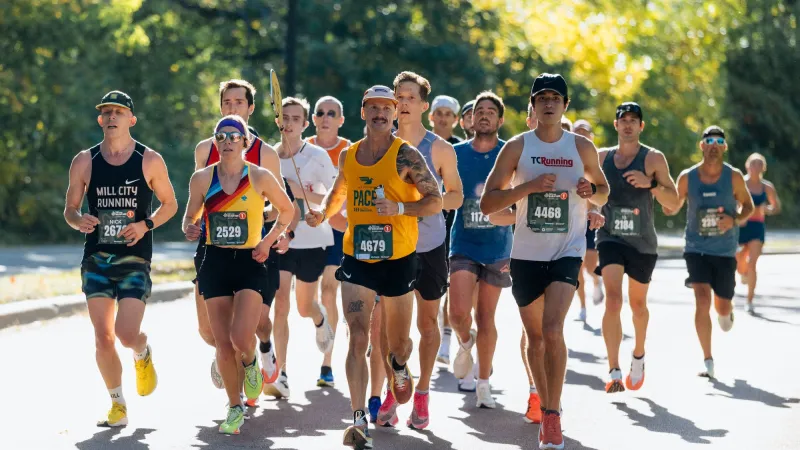 Twin Cities Marathon pacers do the math, carry the flag and help runners reach their goals