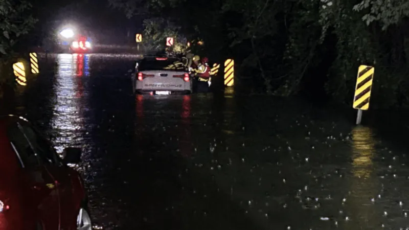 Two vehicles trapped by high water in Columbia
