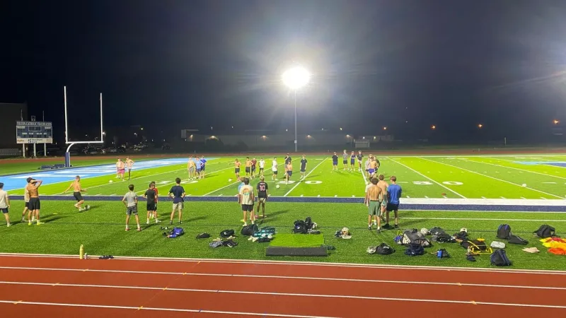 Father Tolton debuts new field in midnight boys soccer practice