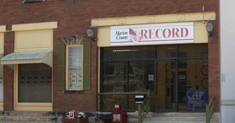 A Kansas town will pay $850K to end a reporter's lawsuit over a 2023 raid on her paper's offices
