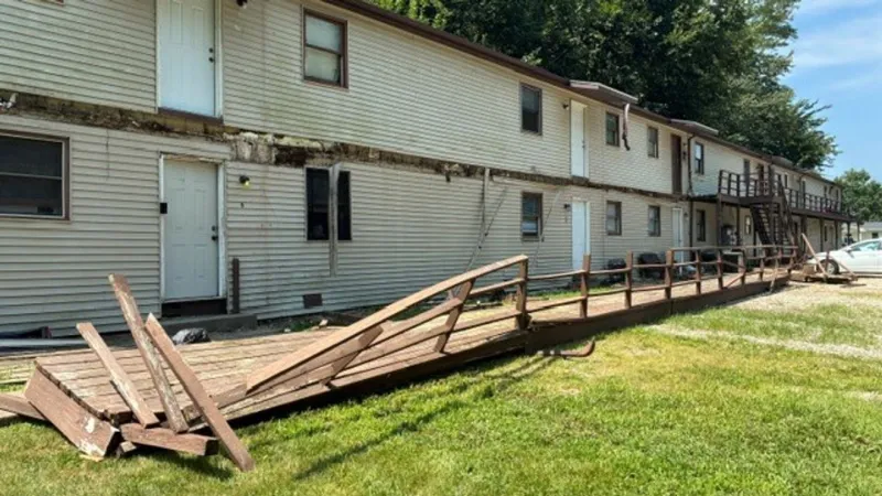 Video shows officers fall as a second-story deck collapses during July arrest attempt