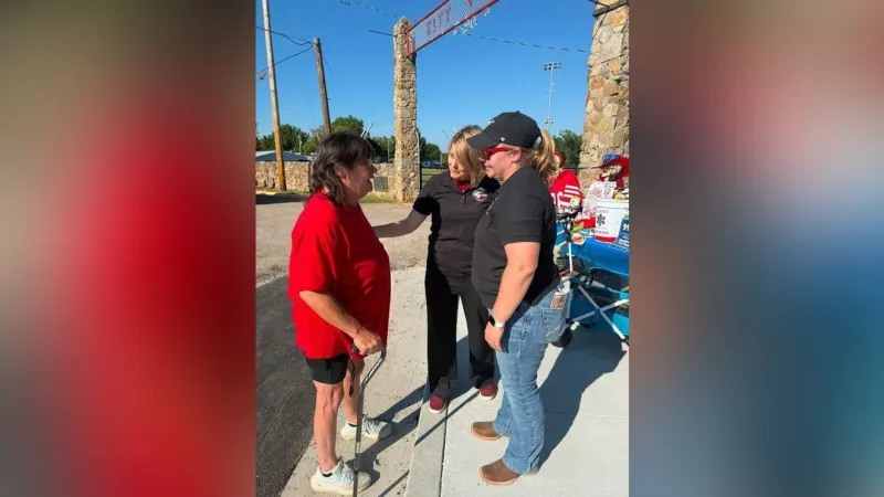 Woman thanks 911 dispatcher at St. James community tailgate for helping save her life