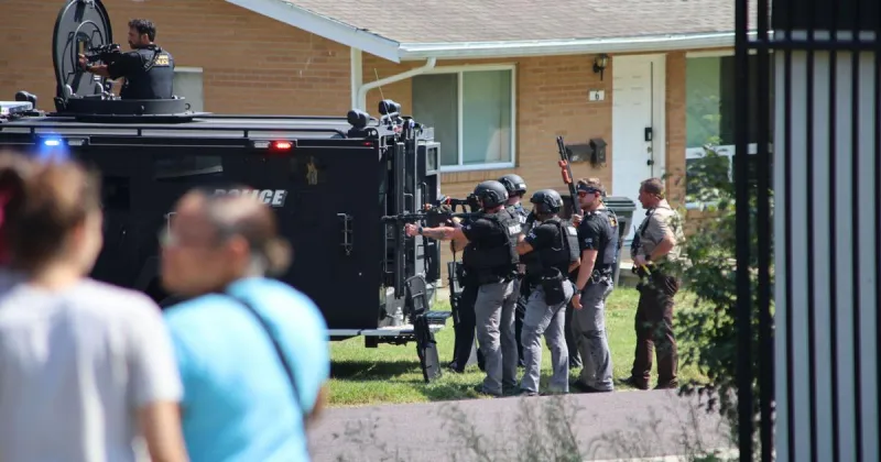 East Broadway closed for two hours during standoff over serving a warrant