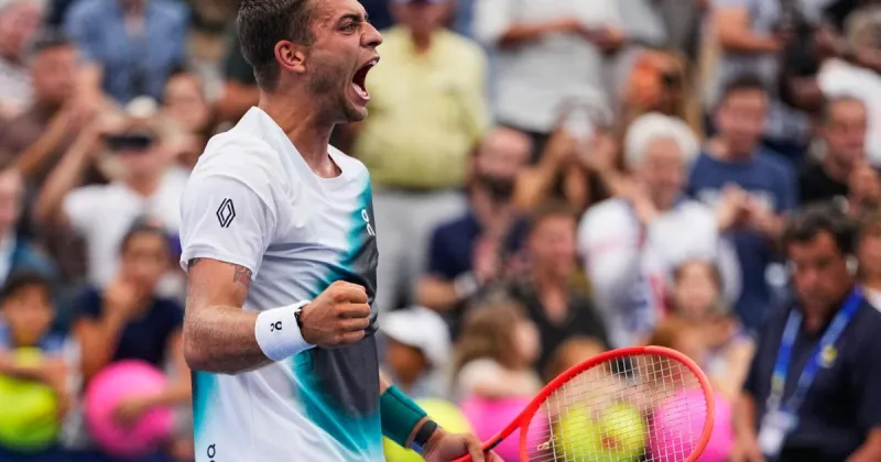 No. 5 Cobolli rallies from two sets down at the U.S. Open as play picks up after a morning of rain