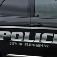 Florissant police shoot out car window after officer dragged