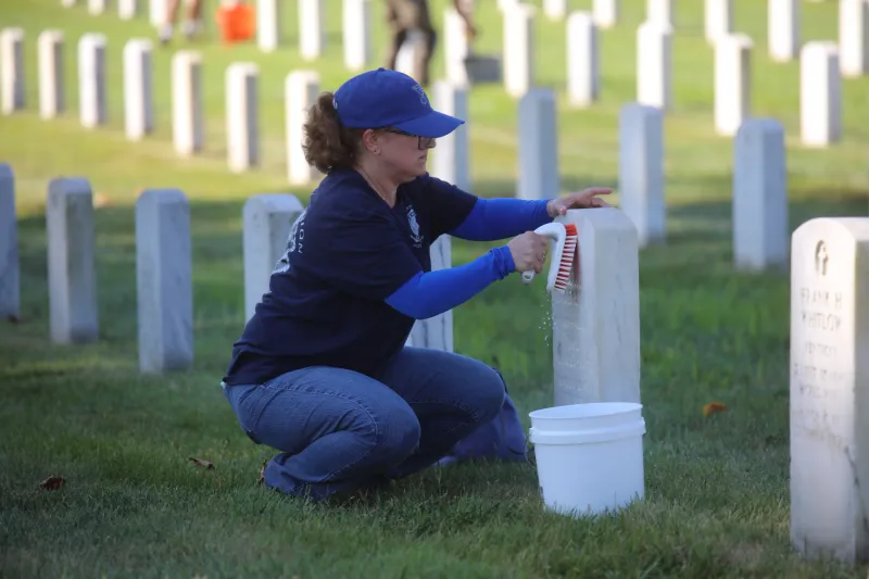 Volunteers gather to clean headstones at Jefferson Barracks for annual Carry the Load memorial event