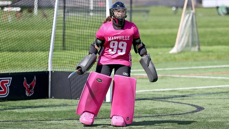 Rhodes Moves Past Saints in Field Hockey Action