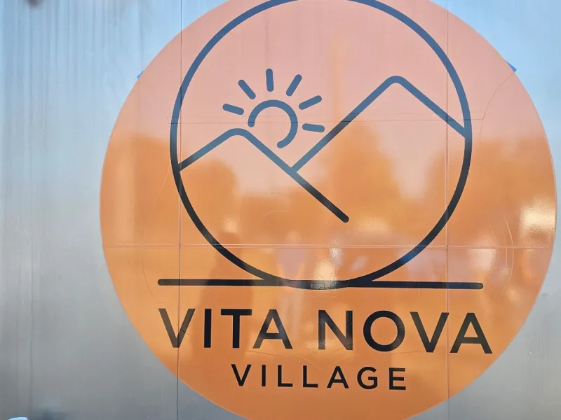 Ribbon Cut as national crew of women builders raises Joplin's Vita Nova Village