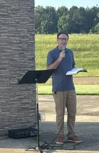 HUGHES LEADS CROSS WORSHIP