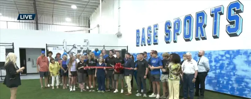 WXXV News 25's Asia Ellis at ribbon cutting for Base Sports Performance