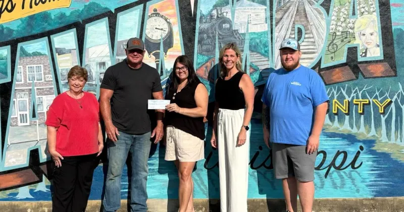 Wood Trailers receives $10,000 check from Freedom Fest drawdown