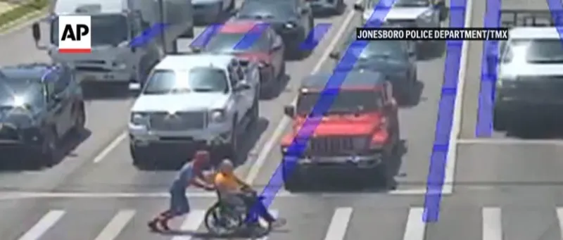 'Spider-Man' superhero jumps to the aid of a man using wheelchair to cross several lanes of traffic