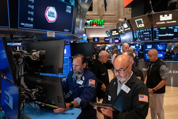 US stocks rise to a record as oil prices drop and inflation gets less bad