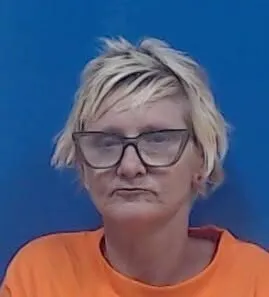 Woman accused of burning property, abandoning dog in George County