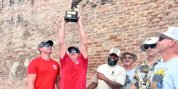 Fire in the hole! Hattiesburg Fire Department scorches competition in 'Bags & Badges' cornhole tournament