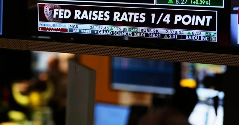 US stocks slip after the Fed hikes interest rates and hints more increases may be on the way