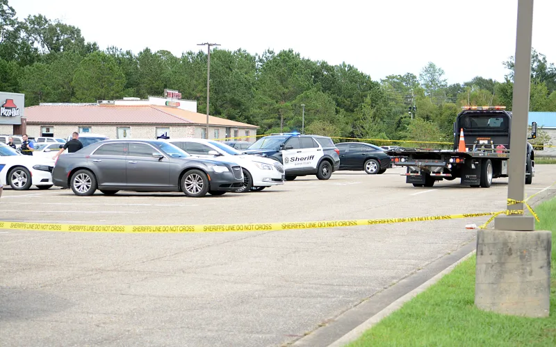 No charges filed yet in parking lot shooting