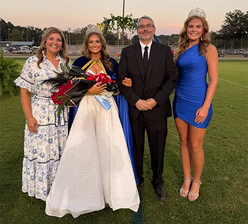 Bruce crowns a queen; Trojans & Cougars win while Rams and Wildcats fall