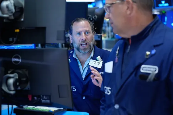 Wall Street holds near its record after Brent oil falls below $100 per barrel