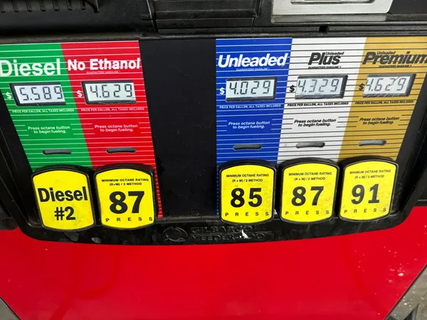 Inflation cooled slightly last month even as consumers stepped up spending