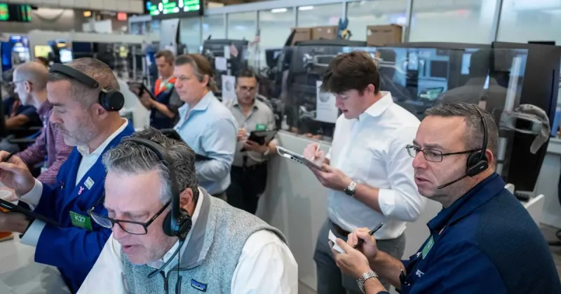 US stocks hover near their latest record in mixed trading on Wall Street