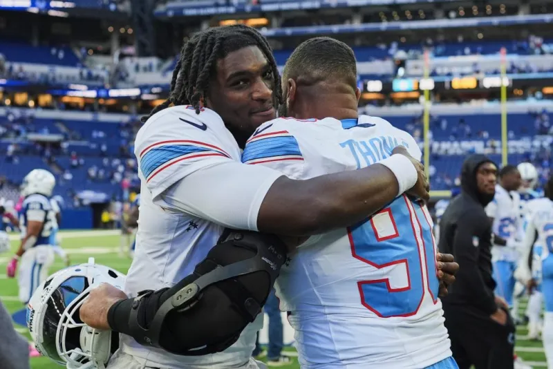 Titans use special teams plays and defense to rally past Colts 26-20 for 1st win of season