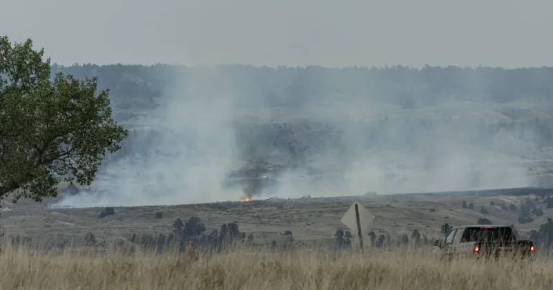 Photo: Wildfire near Lockwood burns in the hills