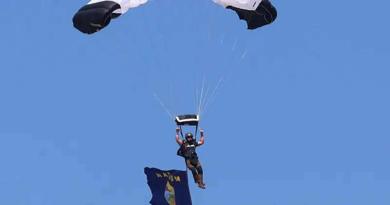 Photo: U.S. Senator Tim Sheehy parachutes into the Yellowstone International Airshow