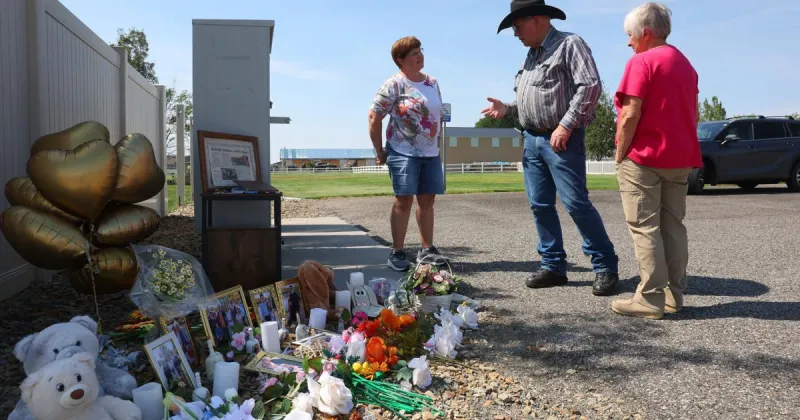Family, neighbors 'quietly honor and remember the lives lost' at shooting memorial