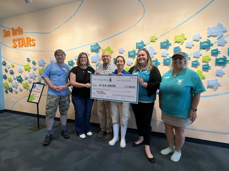 The Cottage Shop's 'Skip the Bag' program donates $1,000 to NC Aquarium's S.T.A.R. Center