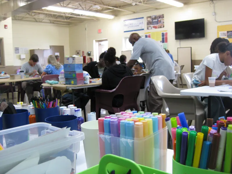For families separated by prison, a day of games, hugs and 'a little bit of normalcy'